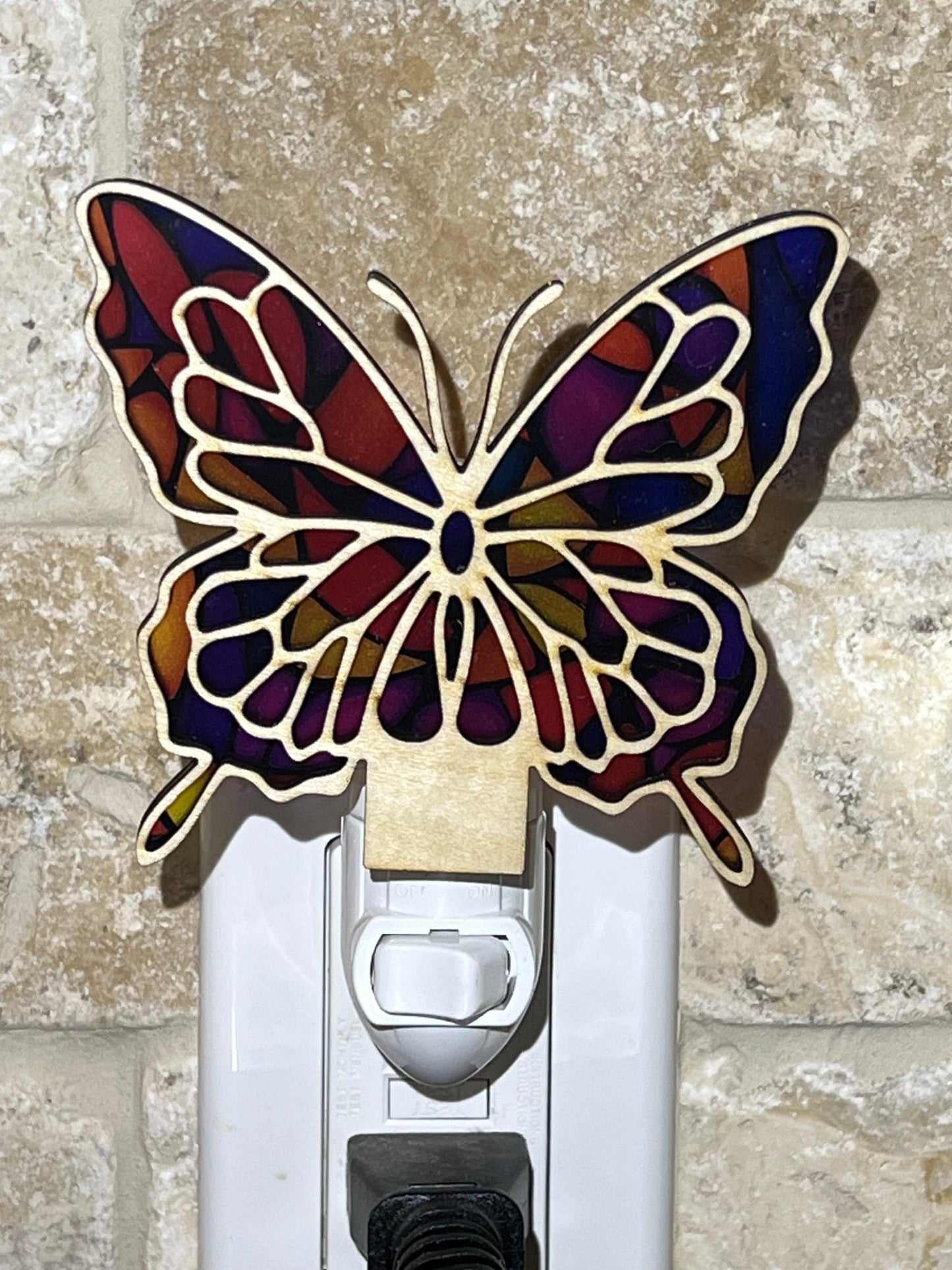 Colorful butterfly nightlight with stained glass effect on wood and acrylic.