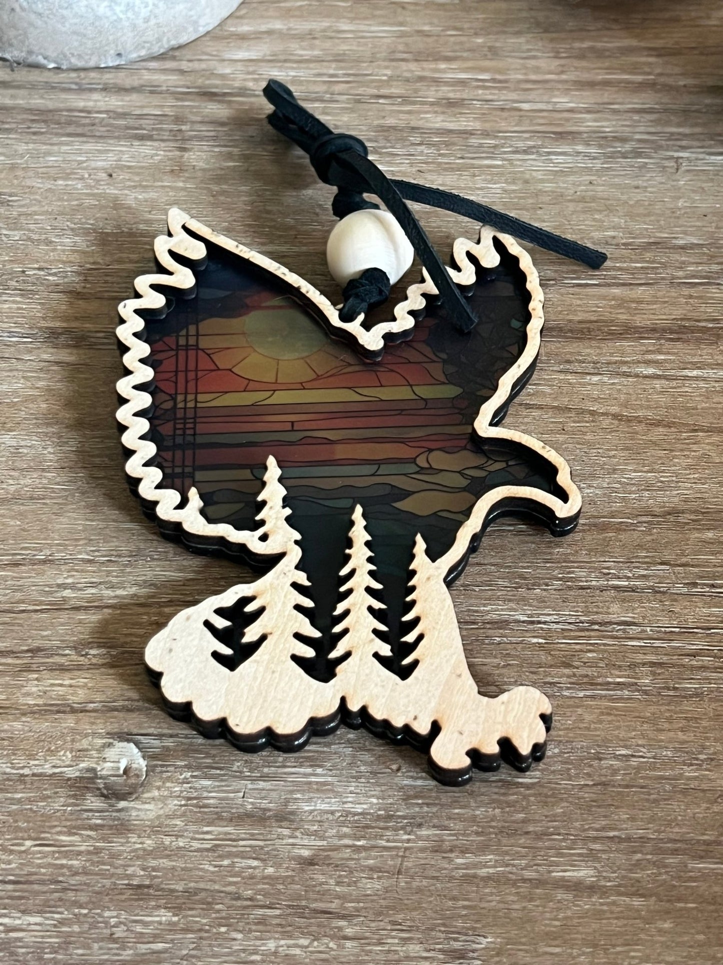 Eagle in flight over mountains suncatcher in wood and multicolor acrylic.