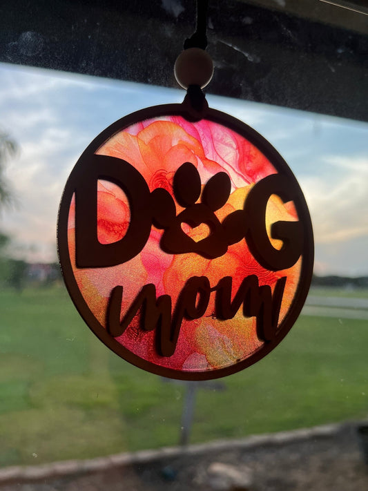 Handmade Dog Mom suncatcher with natural wood and multicolor acrylic offering a rustic stained glass effect in sunlight.