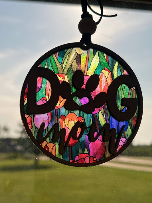 Handmade Dog Mom suncatcher with natural wood and multicolor acrylic offering a rustic stained glass effect in sunlight.