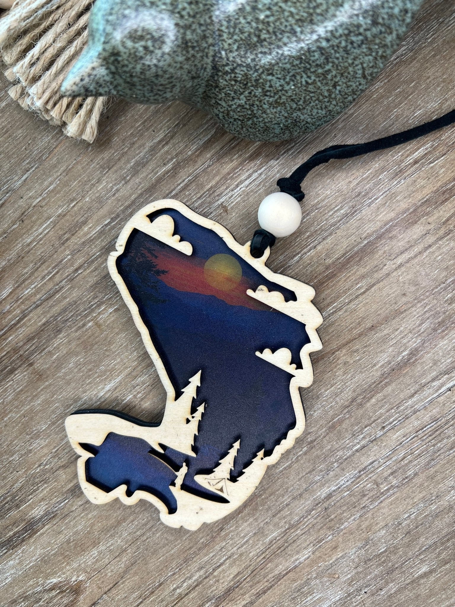 Bass Fish Suncatcher made of wood and acrylic with a stained glass effect and multicolor elements.