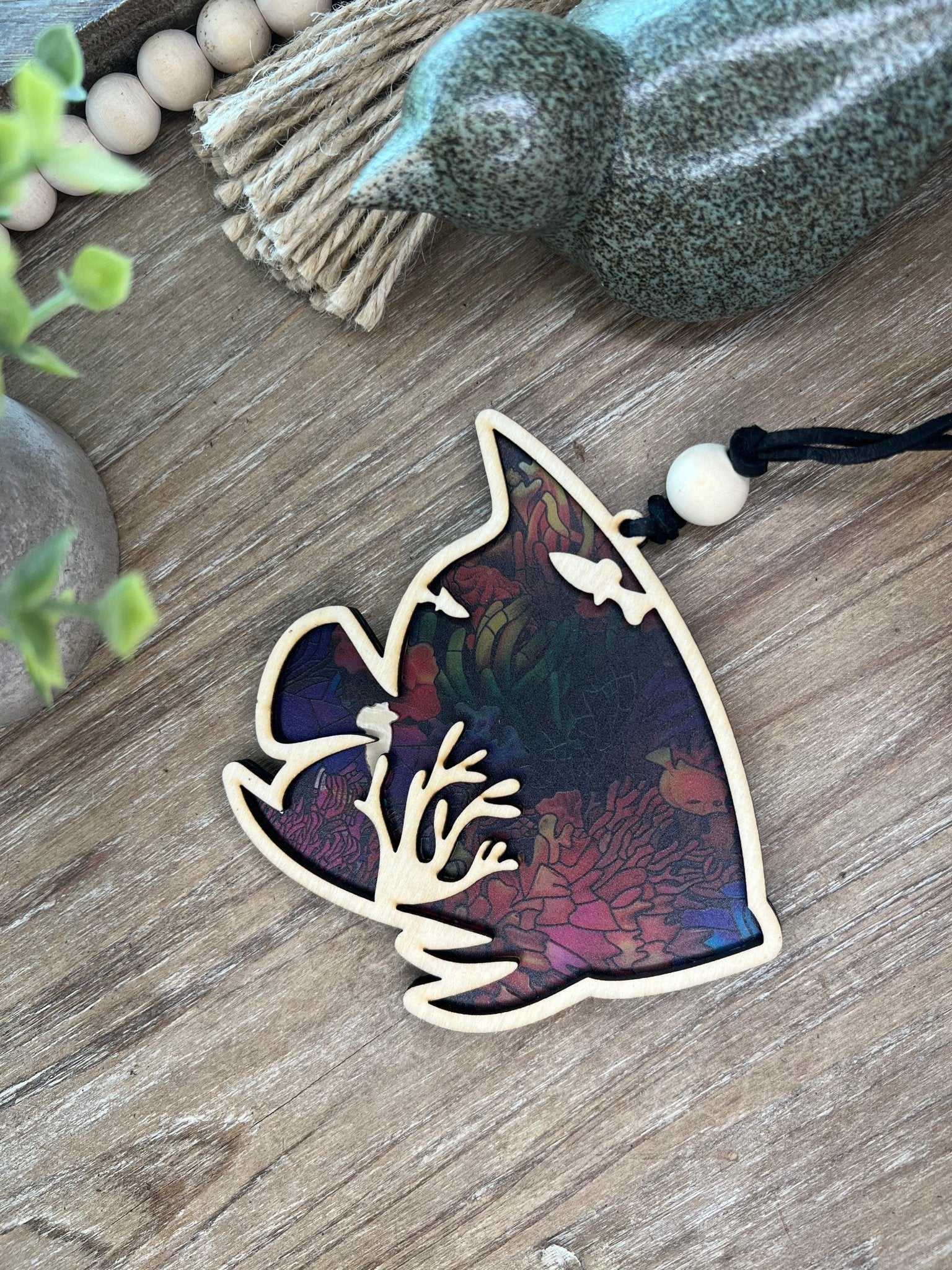 Colorful tropical fish suncatcher with wood and stained glass effect acrylic, 4.75 x 4.5 inches.