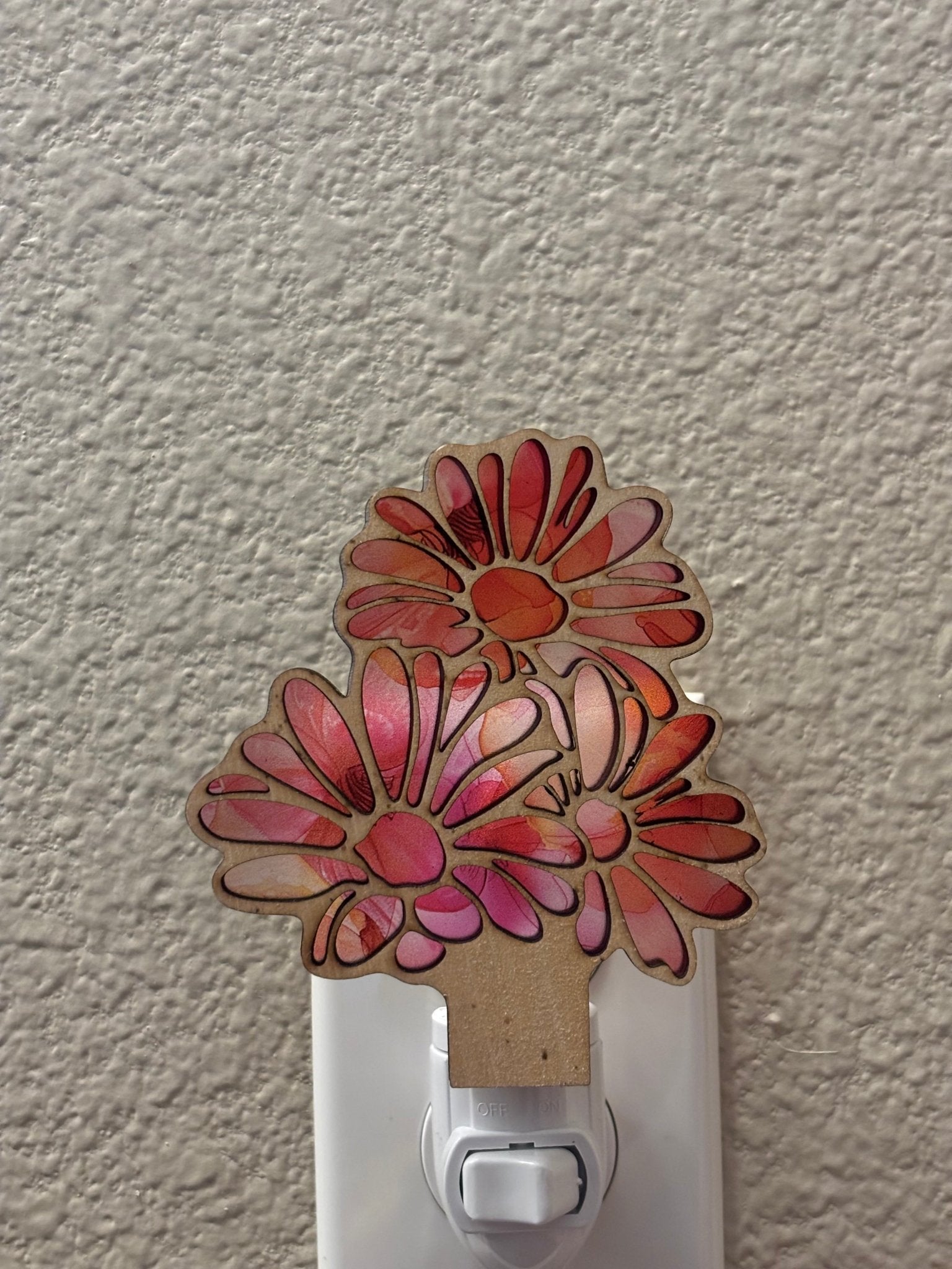 Daisy Flowers Nightlight in rustic wood and multicolor acrylic, 5.5” x 3.5”, glowing warmly.