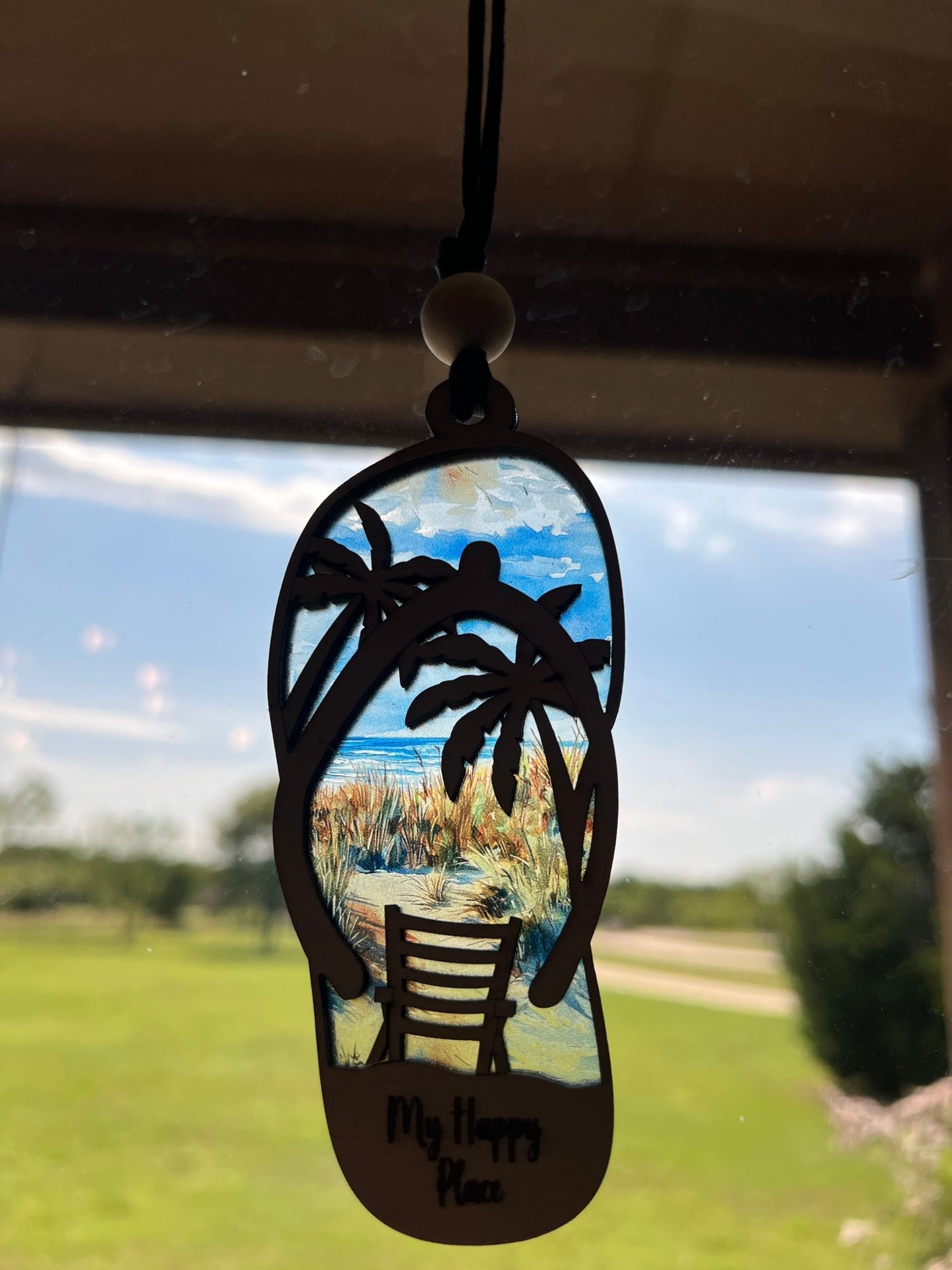 Flip Flop Beach Suncatcher with multicolor stained glass effect on wood and acrylic, ideal for rustic decor in sunlight.