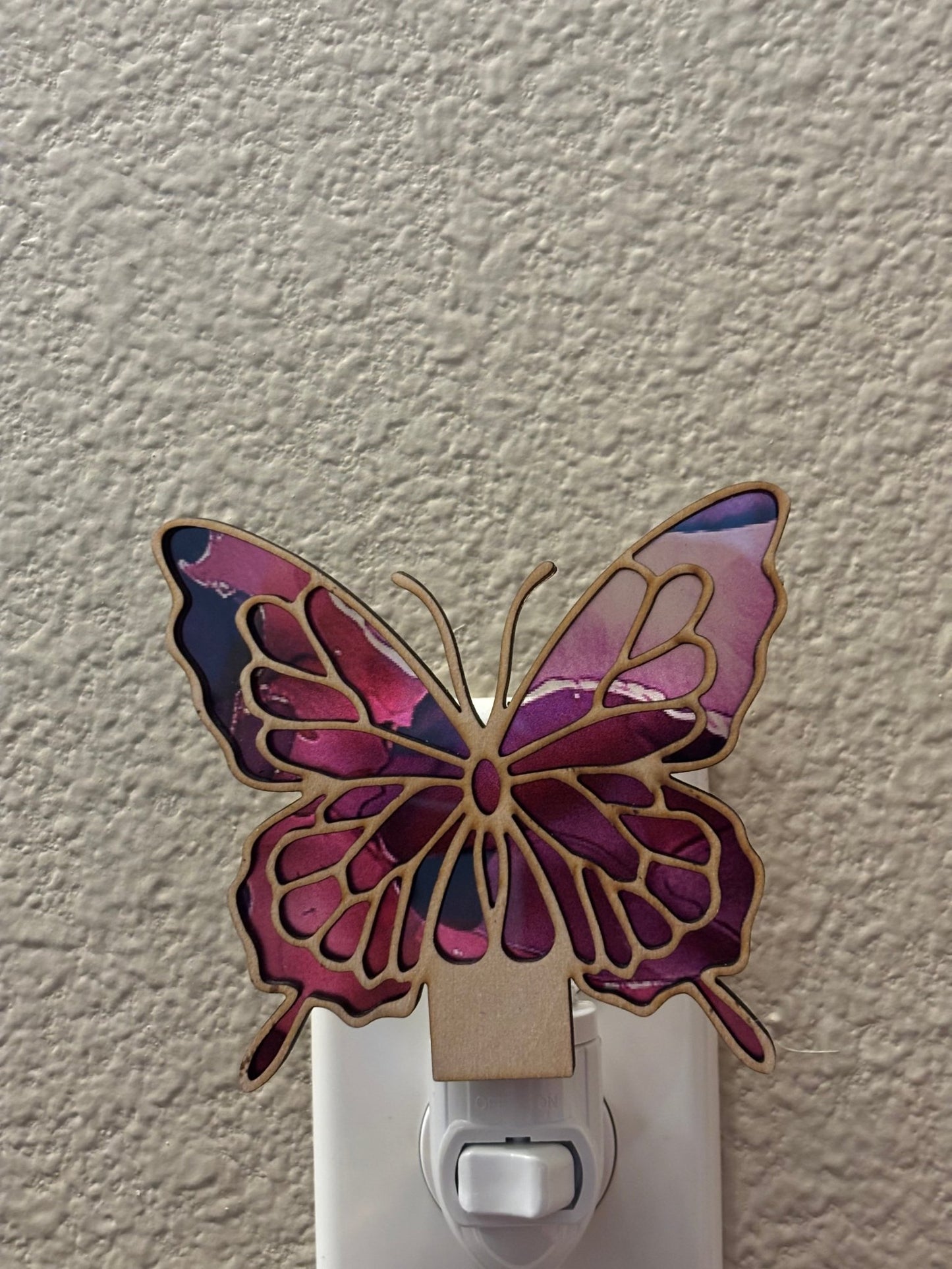 Butterfly stained glass effect nightlight with wood and acrylic, multicolor unlit.