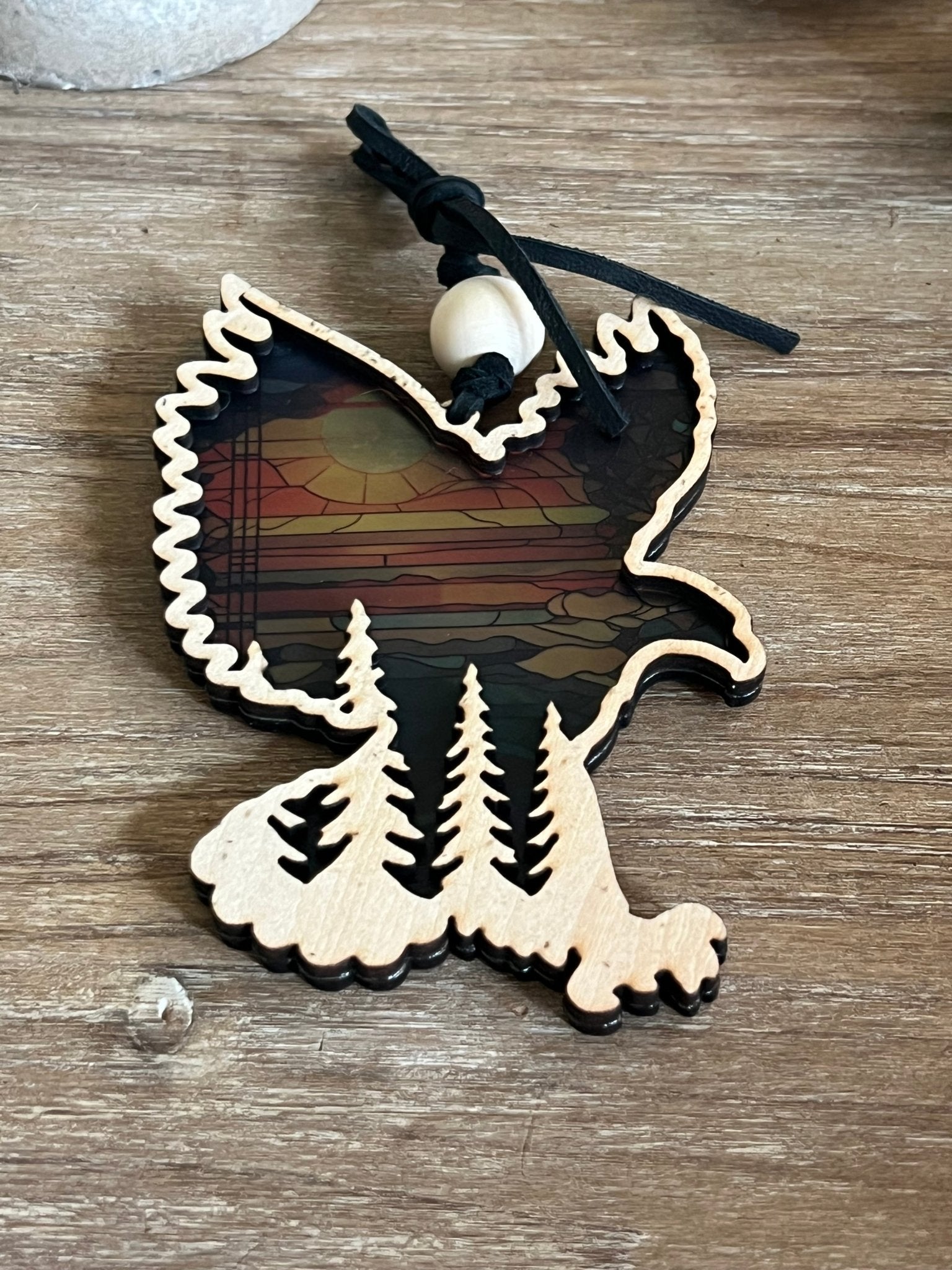Eagle in flight over mountains suncatcher in wood and multicolor acrylic.