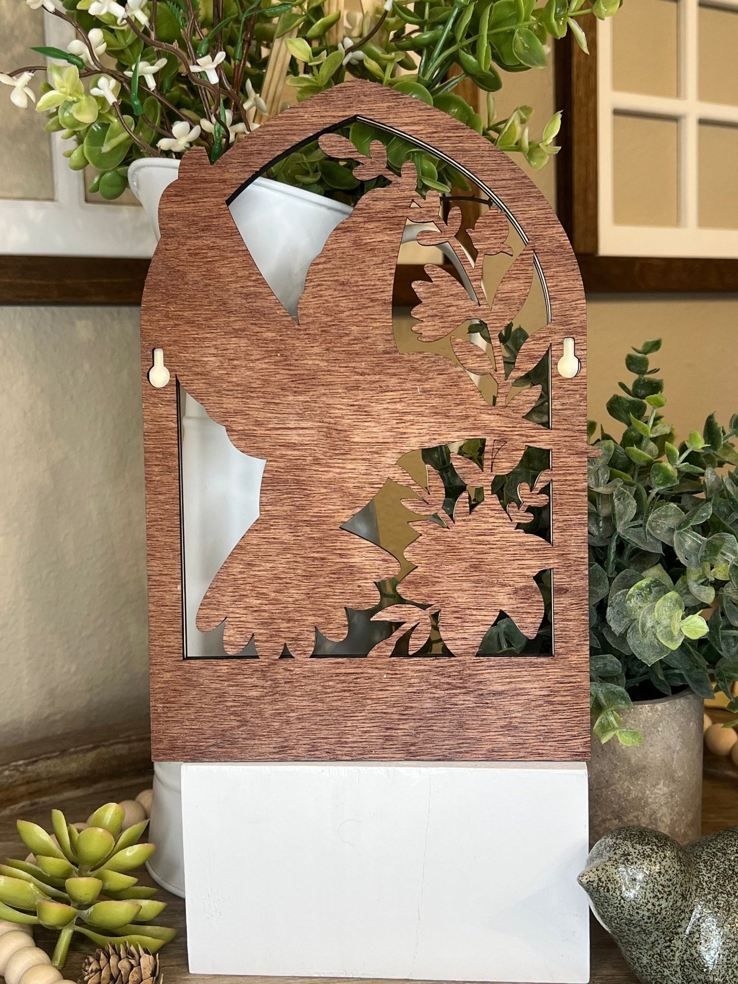 Laser-cut wooden key holder featuring a layered hummingbird and floral design with six hooks view from the bac — rustic home wall decor by Bear Necessity Designs.