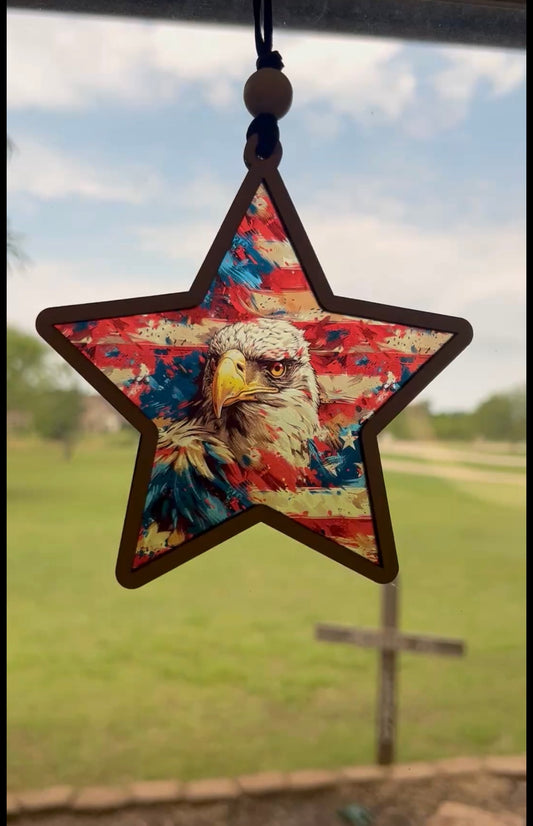 American Eagle star suncatcher with wood and multicolor acrylic, 5.5 inches in sunlight.