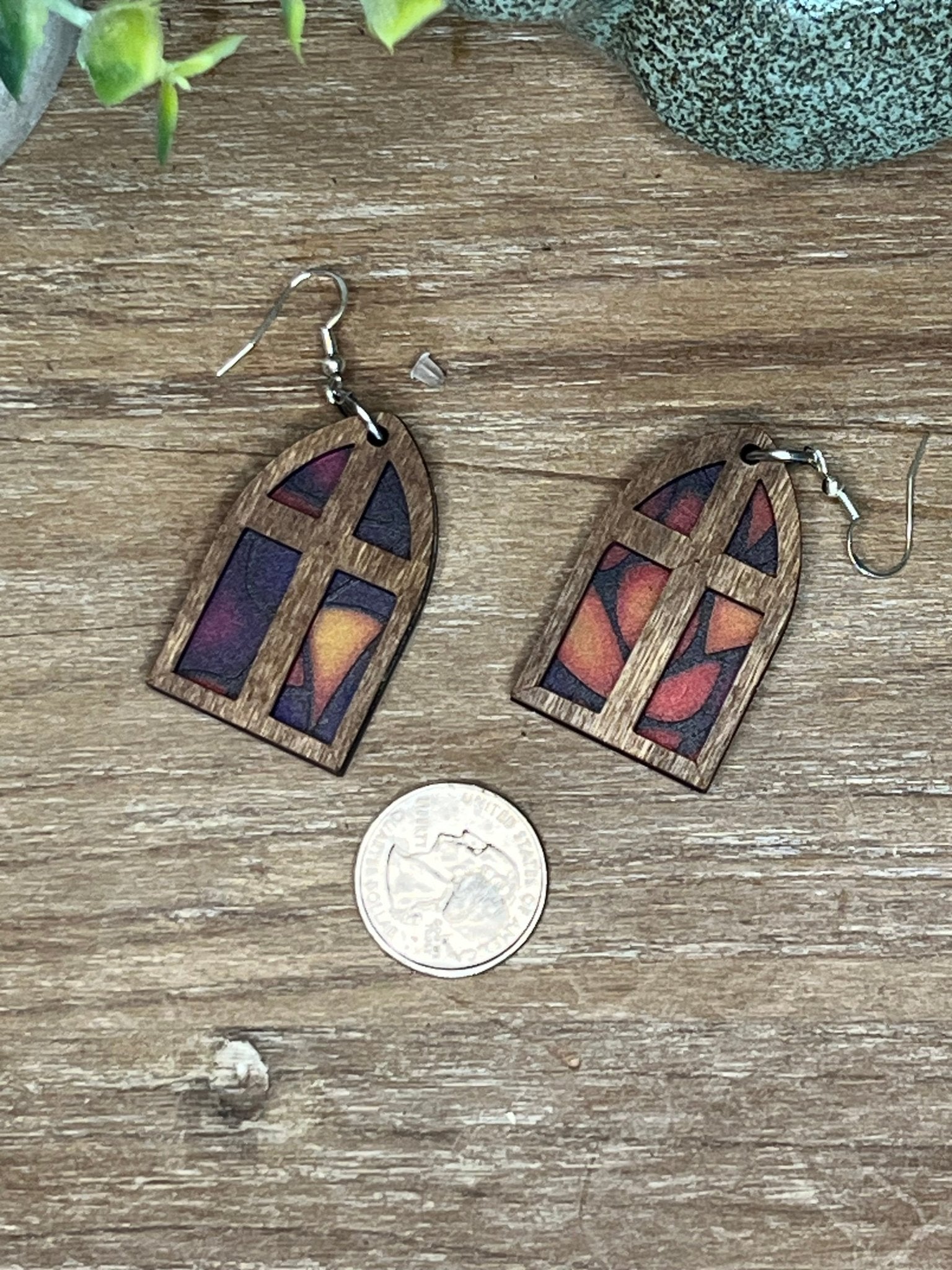 Arched window stained glass effect earrings made of wood and acrylic, showcasing a colorful and rustic design.