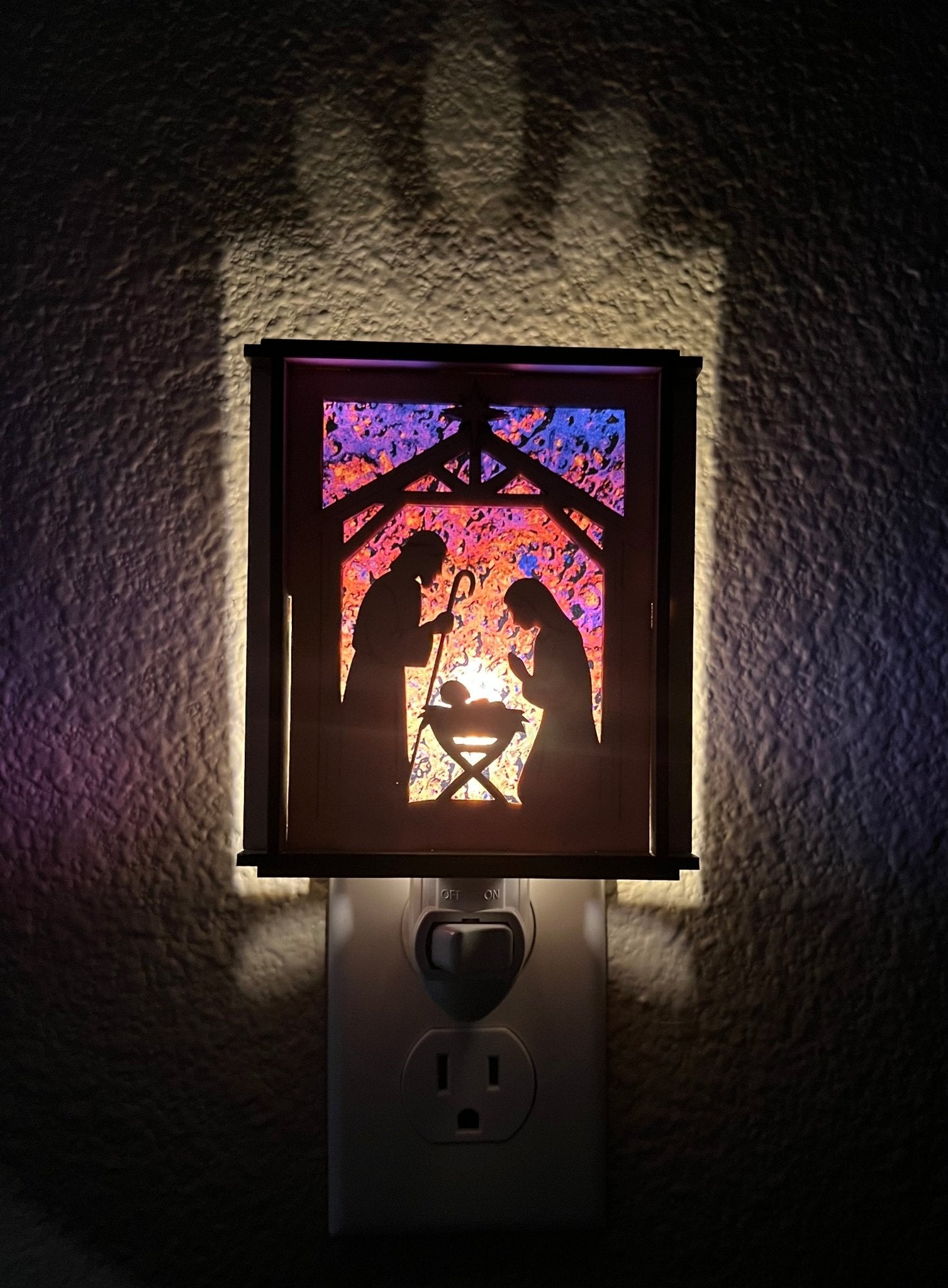 Natural wood Christmas Nativity Lantern Nightlight with multicolor designs. Light and front view