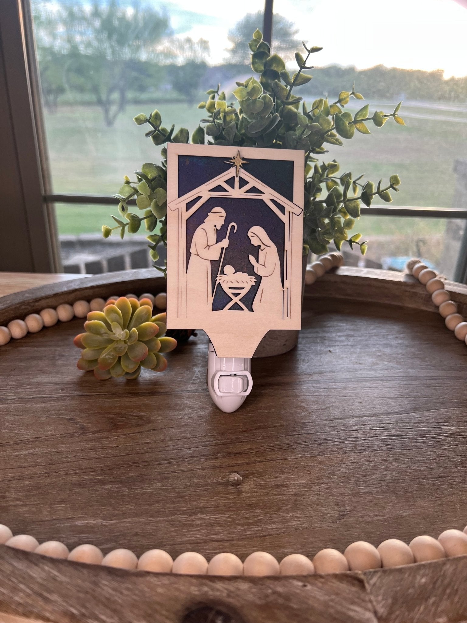Christmas Nativity Nightlight made of wood and acrylic, featuring natural wood and multicolor elements in natural light.