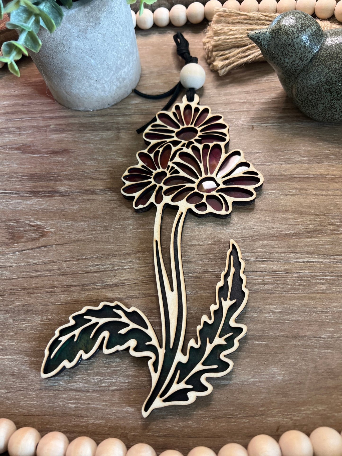 Daisy Flower and Stem Suncatcher with wood and multicolor acrylic, capturing sunlight beautifully.