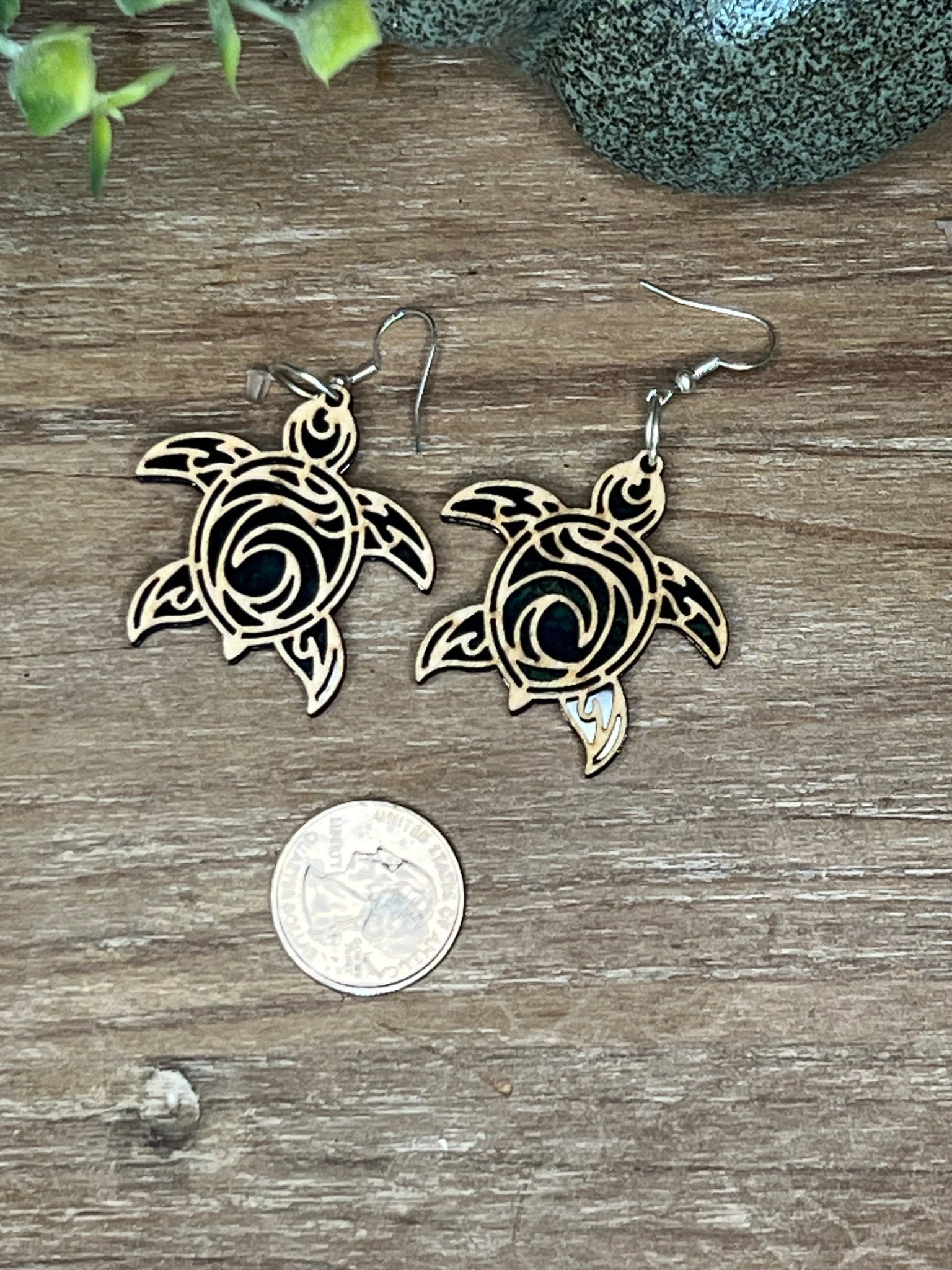 Pair of turtle-shaped stained glass effect wood and acrylic earrings in natural wood and multicolor.
