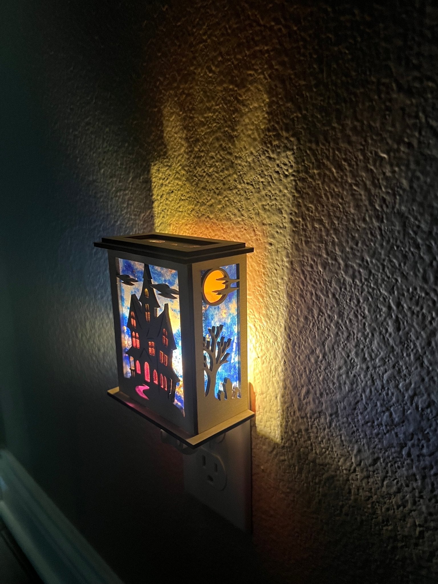 Halloween Haunted House Lantern Nightlight made from wood and acrylic, showcasing rustic charm and multicolor glow lighted in a hall right view.