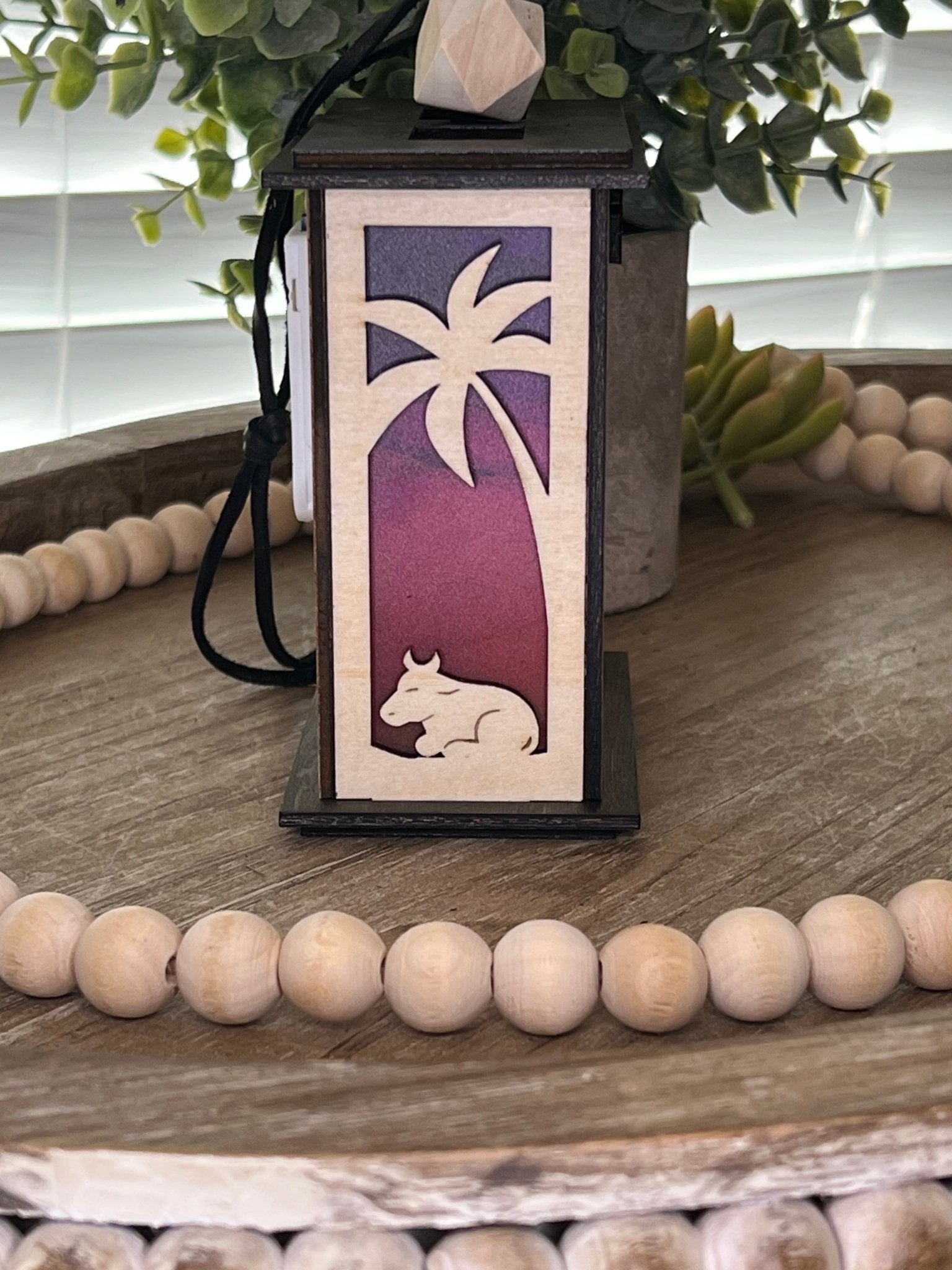 Lighted Christmas Nativity Lantern Ornament made with a natural and walnut stain and acrylic, left side, unlighted view.