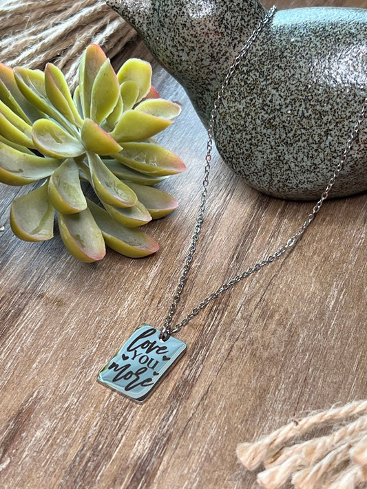 Engraved silver necklace made of stainless steel with a love message.