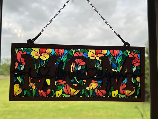 Yellow floral suncatcher with wood and acrylic, rustic charm, 4.25x9.5 inches in sunlight.