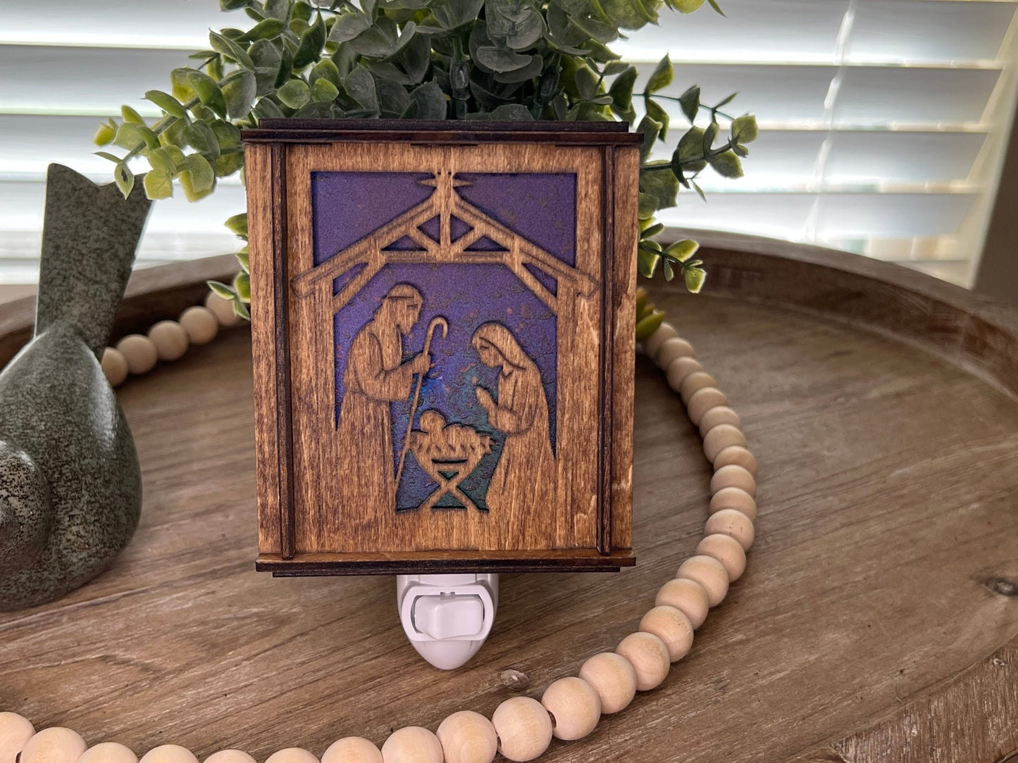 Golden oak stained wooden and acrylic nativity nightlight with rustic charm front standing up and unlit.