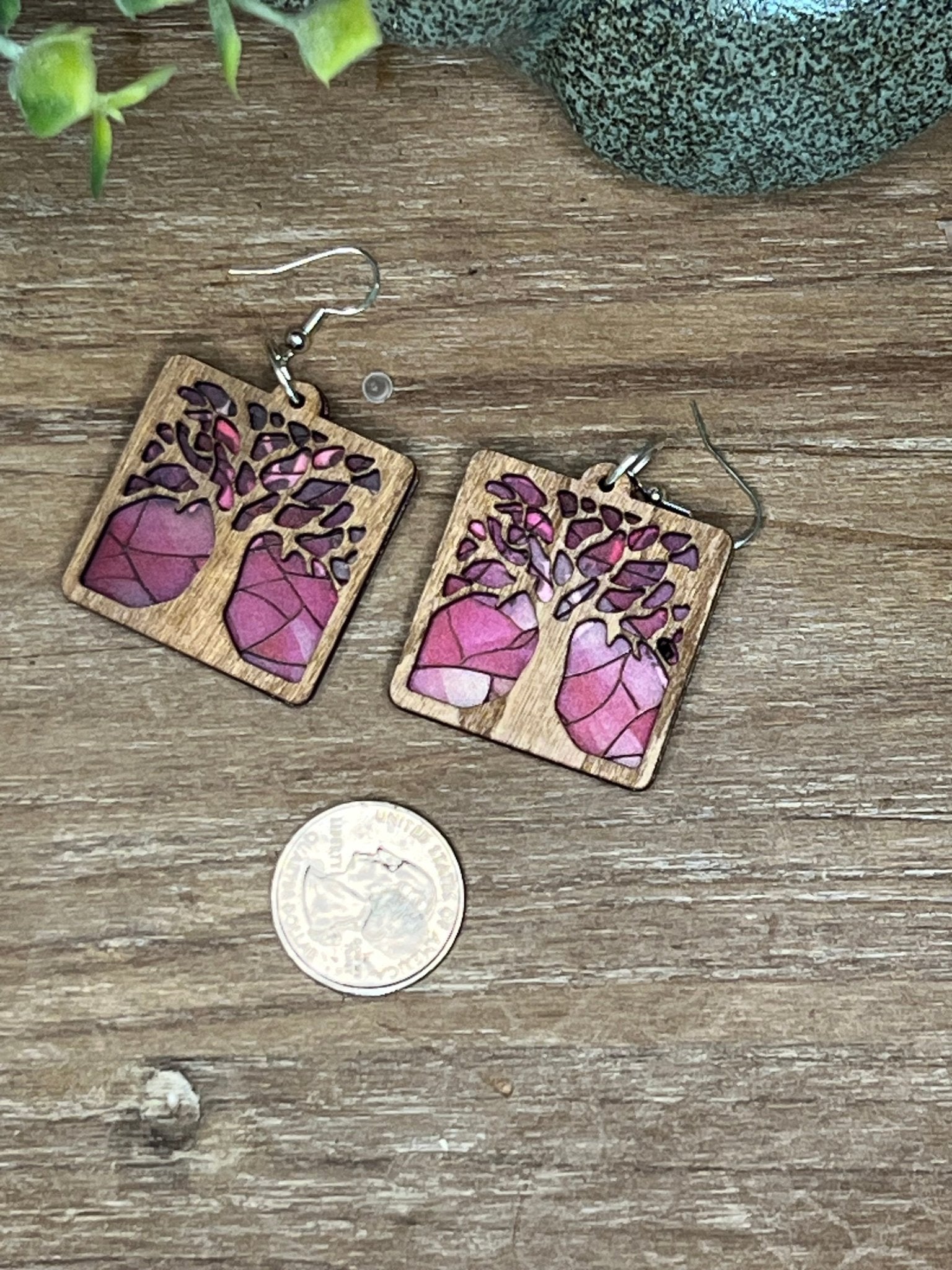 Tree of Life earrings with stained glass effect, made of wood and pink acrylic, in a rustic-modern style.