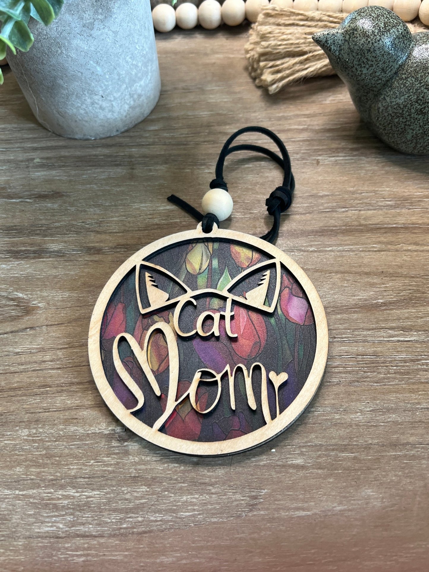 Tulip Cat Mom Suncatcher made of natural wood and multicolor acrylic with stained glass effect.